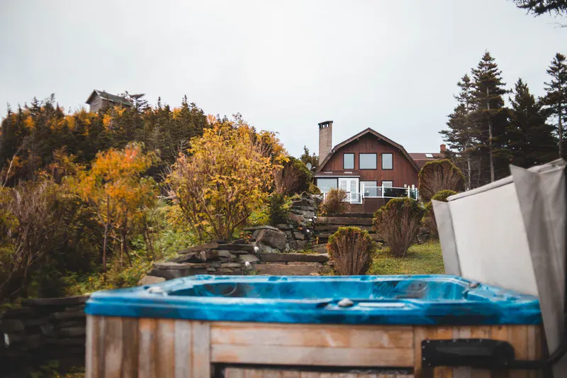 Old hot tub on a backyard deck ready to be dismantled and hauled away